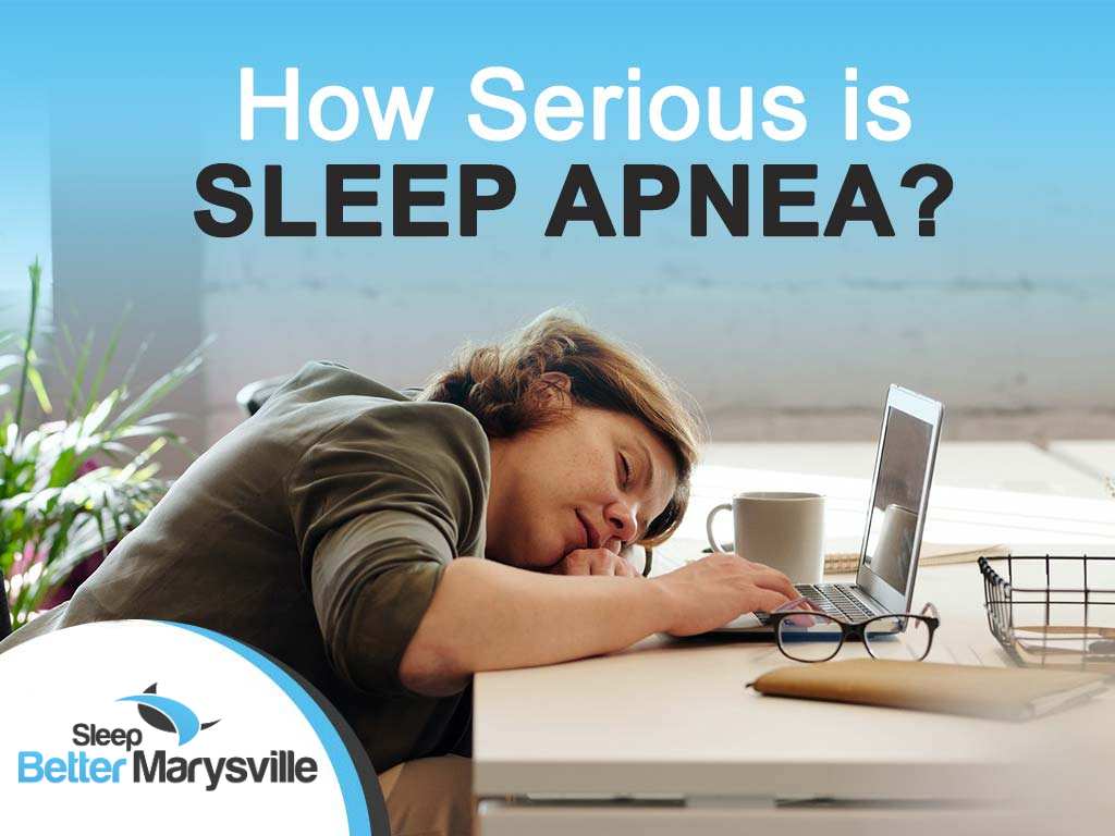 Woman sleeping at her desk, featured in Sleep Better Marysville's discussion on how serious sleep apnea is.